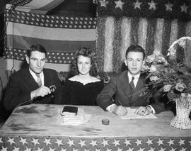 Woman and two men are announcers at the 1943 Little International Exposition at South Dakota State College.