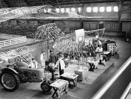 Display of farm machinery in the arena at the 1941 Little International Exposition at South Dakota State College.