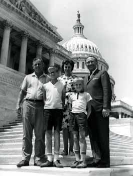 Representative Ben Reifel with Mr. and Mrs. Julius Pleinis and sons on the steps of the US Capitol in 1965