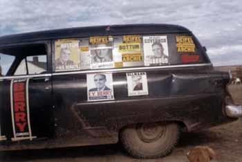Car covered with Republican campaign posters