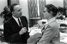 Representative Ben Reifel speaks with a woman in 1968