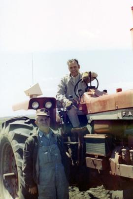 Frank Denholm with a farmer in 1970
