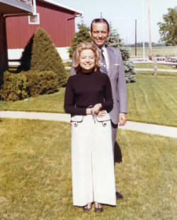 Frank and Millie Denholm pose for a photograph outdoors