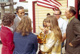 Frank Denholm talking with constituents by the Democratic headquarters at the South Dakota State Fair in Huron, South Dakota.