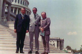 Frank Denholm stands with two constituents on the steps of the U.S. Capitol in Washington, D.C.