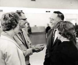 Representative Ben Reifel talk with the parents of the Fischer quintuplets born in Aberdeen, South Dakota in 1963