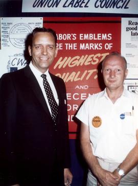 Frank Denholm with a representative of the Union Label Council.