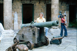 Portait of a man behind cannons at the Fortaleza de San Carlos de la Caba