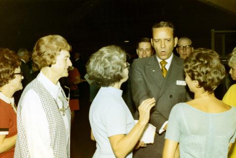 Frank Denholm talking to constituents at a campaign event.