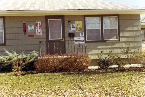 Campaign posters supporting democrat candidates posted on a house in 1970