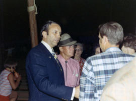 Frank Denholm greeting constituents at an event.