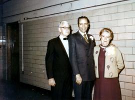Frank Denholm with Floyd Rasmussen and Katie Kuhns at an event.