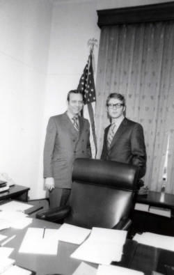 Frank Denholm with a member of his staff in his office.