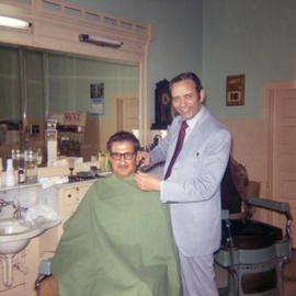 Frank Denholm in a barber shop