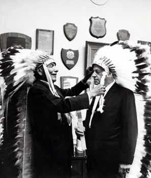 Representative Mike Kirwan wearing an American Indian headdress