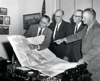 Representative Ben Reifel meet with constituents to discuss the Vermillion River flood control project in 1962