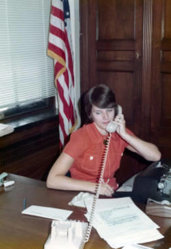 Staff member talking on a telephone in Frank Denholm's Washington, D.C. office.