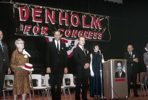 Frank Denholm and others on stage during a Denholm for Congress rally in Brookings, South Dakota
