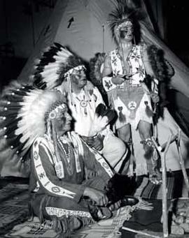 Three men in American Indian dress