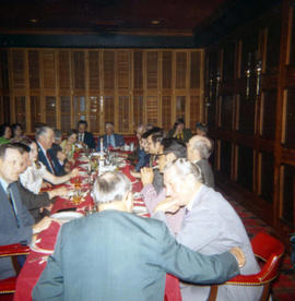 Frank Denholm sharing a meal with a group of constituents in a restaurant.