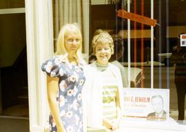 Millie Denholm and another woman standing in front of Democratic campaign headquarters.