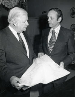 Senator Tip O'Neill is with Congressman Frank Denholm, they are holding a map
