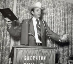 Frank Denholm speaking at an event at the Sheraton Motor Inn
