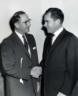 Representative Ben Reifel shakes hands with Richard Nixon