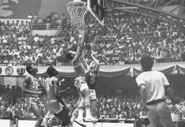 Action photo of basketball game between USA team from South Dakota delegation and Cuban national team