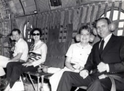 Frank and Millie Denholm and others are in a military transport helicopter during a trip to South Korea.