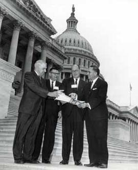 Representative Ben Reifel, Joe Holland, Gordon Thune, and Hoyt Granter on the US Capitol steps in 1964