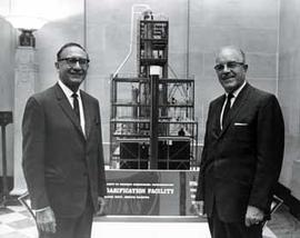 Representatives Ben Reifel and E.Y. Berry by a model of a gasification facility in 1968