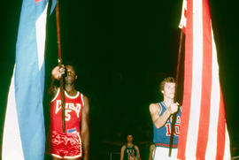 Cuban and US flags in opening ceremony of basketball game in Cuba