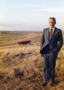 Frank Denholm standing in a cow pasture at a western South Dakota ranch.