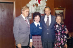 Frank and Millie Denholm with another couple at a Christmas party.