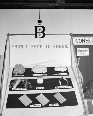 Block and Bridle Club booth at the 1948 Little International Exposition at South Dakota State College. Sign reads: B. From Fleece to Fabric.