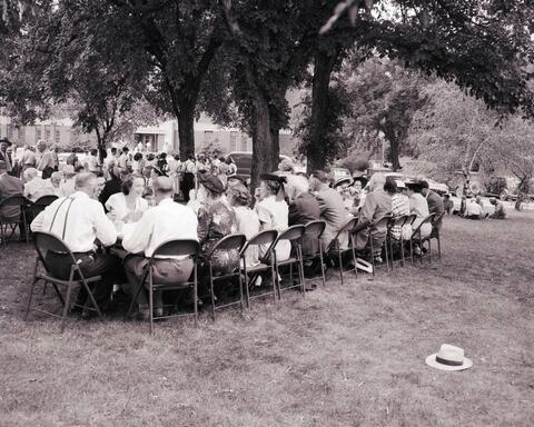 Crowds of people gathered for a reception for the recognition service for Dr. N.E. Hansen n the campus of South Dakota State College.