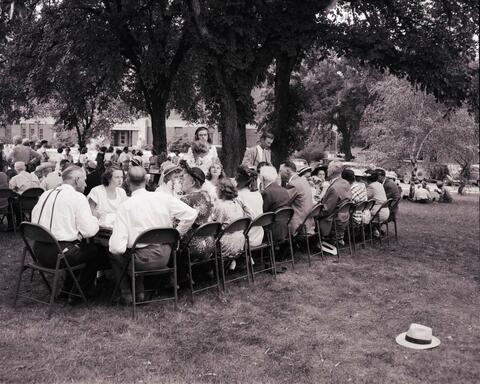 Crowds of people gathered for a reception for the recognition service for Dr. N.E. Hansen n the campus of South Dakota State College.