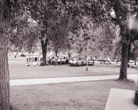 Crowds of people gathered for a reception for the recognition service for Dr. N.E. Hansen n the campus of South Dakota State College.