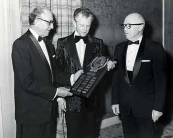 Representative Ben Reifel with two other men and a Connecticut Mutual Life plaque