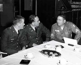 Representative Ben Reifel talks to two constituents at the Vicenza Military Post's Non-Commissioned officers Club in 1961