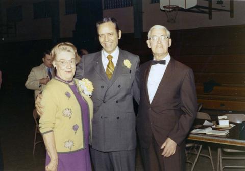 Frank Denholm with constituents at an event in a gymnasium.