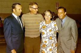 Frank Denholm (left) and Richard Kneip (right) with a man and woman at a campaign event.
