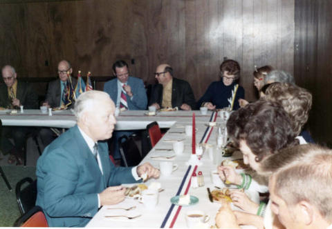 Frank Denholm at a luncheon meeting with a group of constituents.