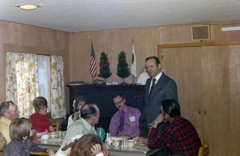 Frank Denholm with constituents in a restaurant.