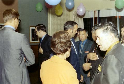 Frank Denholm mingling with guests at an event.