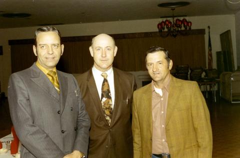 Frank Denholm with Wayne Hauschild and another man at an event.