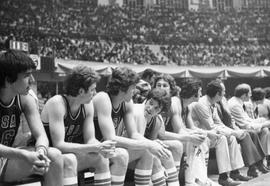 South Dakota delegation to Cuba basketball players on the bench during game against Cuban national team