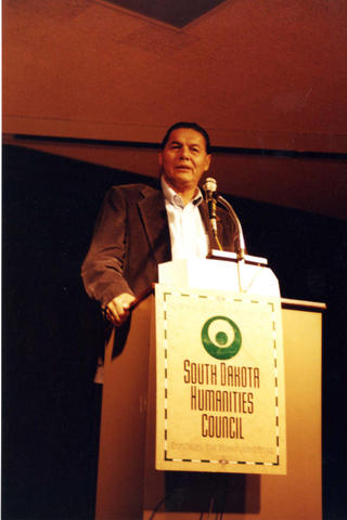 Joseph Marshall speaking at poetry reading at a South Dakota Humanities Council event.