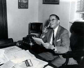 Representative Ben Reifel recording dictation in his office